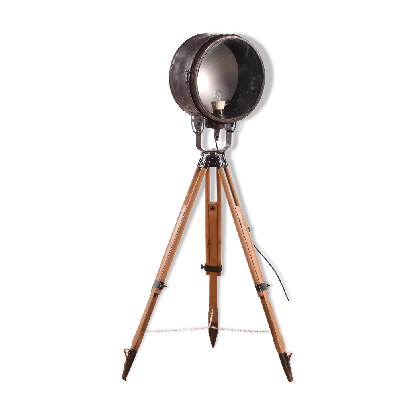 Old industrial spot on wooden tripod floor lamp