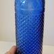Vintage decanter bottle made of blue molded pressed glass