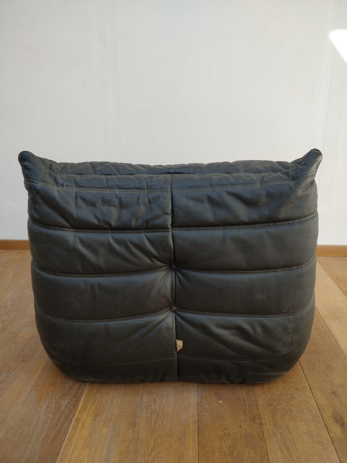 Togo in black leather by Ligne Roset
