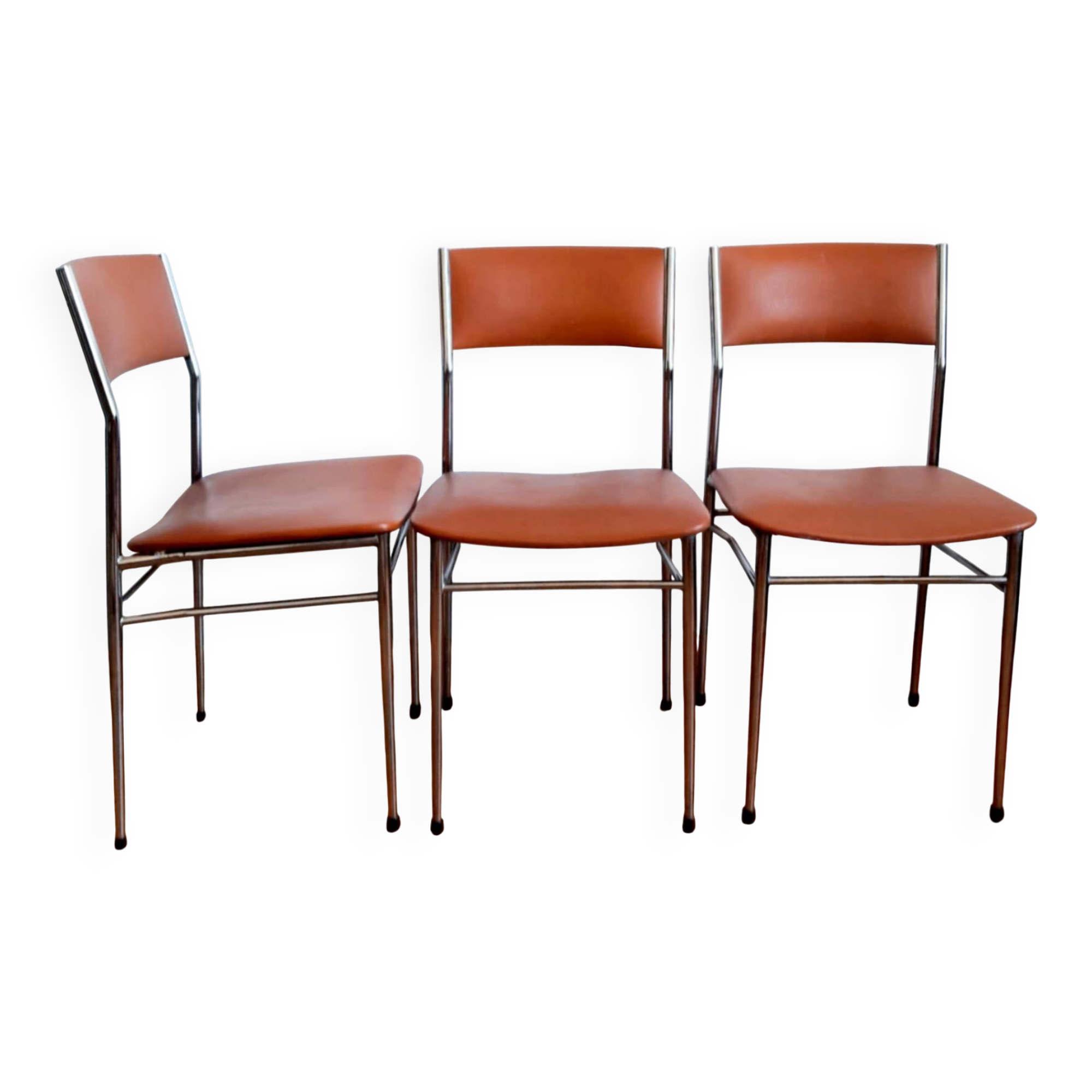 Three mid-century chairs in faux leather and chrome from the 1950s.