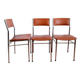 Three mid-century chairs in faux leather and chrome from the 1950s.