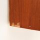 Teak display cabinet with black hairpin legs.