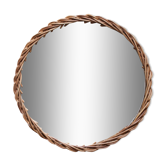 Decorative mirrored tray surrounded by vintage rattan/wicker