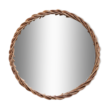 Decorative mirrored tray surrounded by vintage rattan/wicker