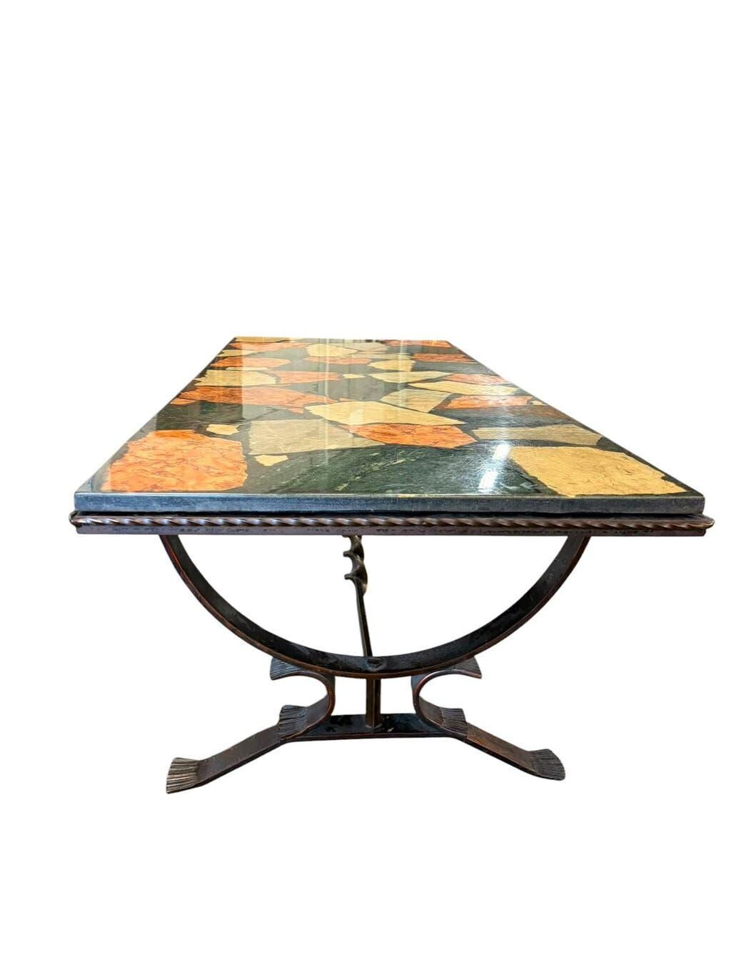Vintage stone coffee table with a cast iron frame.