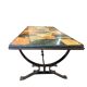 Vintage stone coffee table with a cast iron frame.