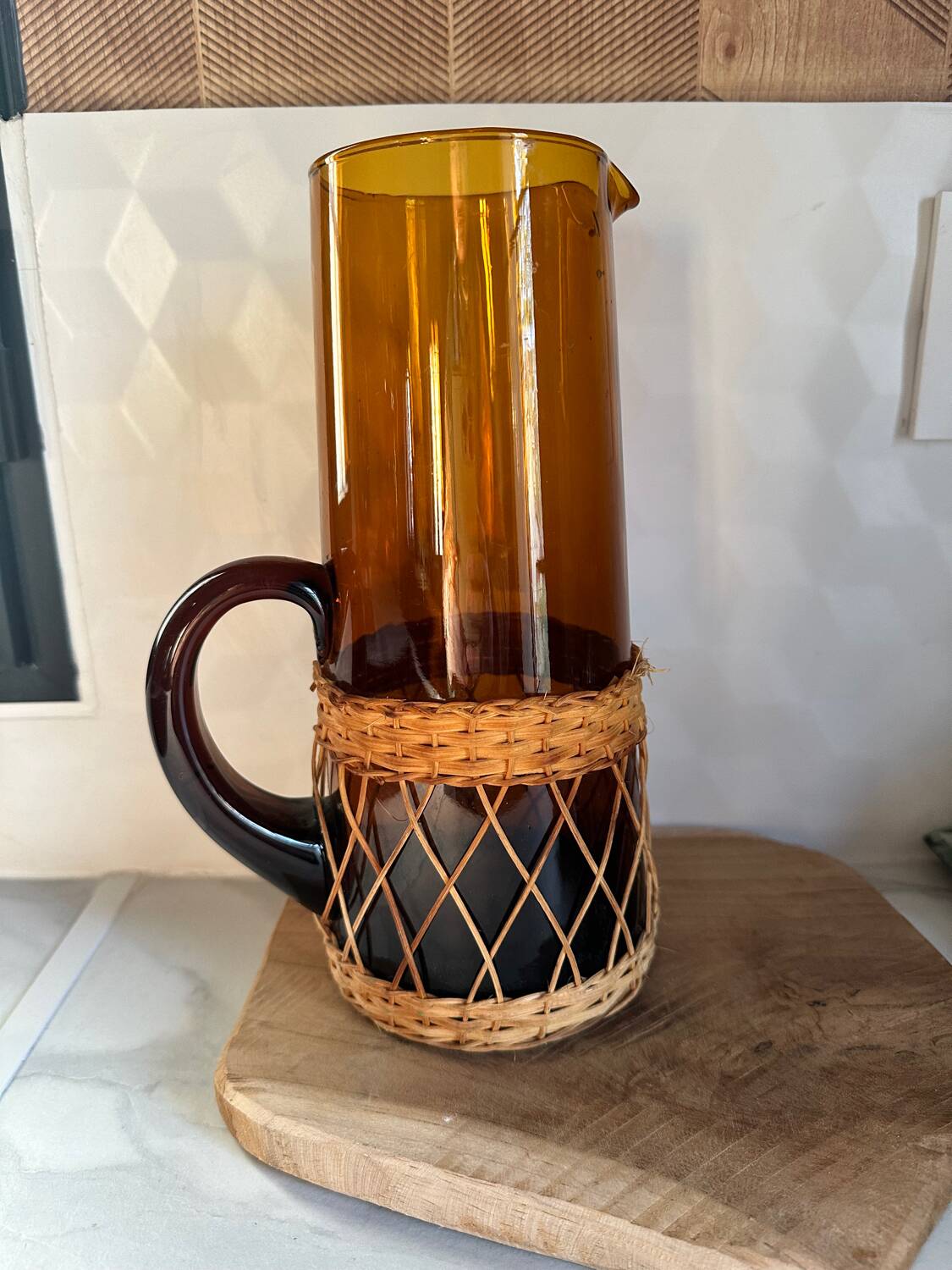 Vintage orange and wicker carafe