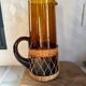 Vintage orange and wicker carafe