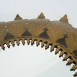 Old sun mirror with foliage in gilded metal with twisted frieze from the 60s