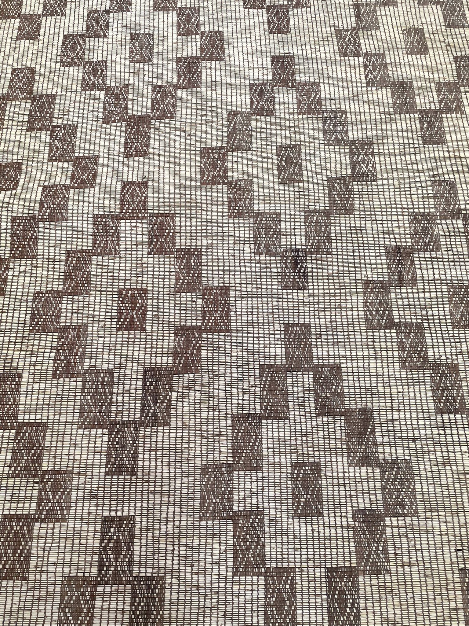 Vintage Touareg mat made of leather and reeds.