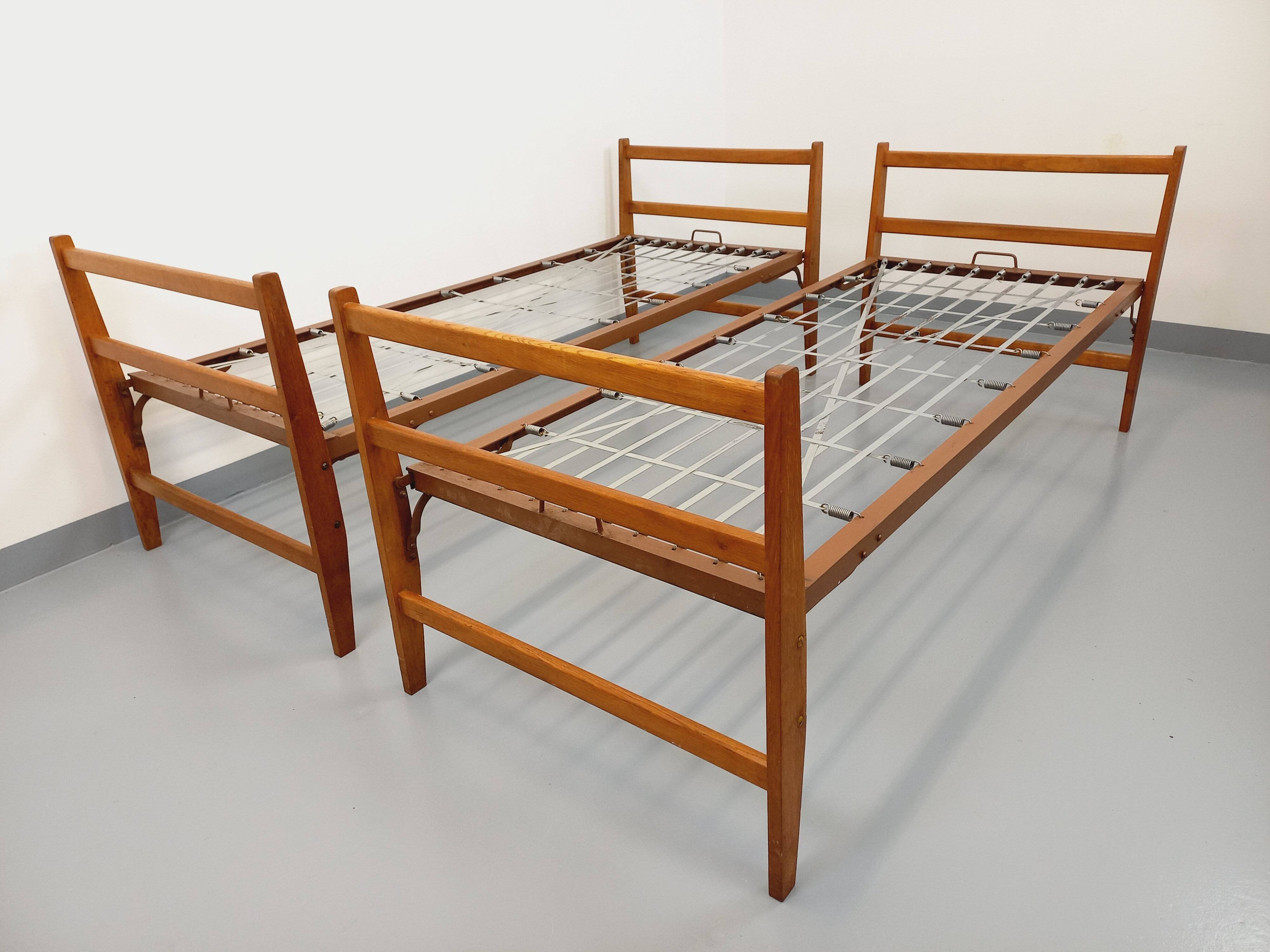 Pair of vintage stackable daybeds in oak wood and metal from the 60s