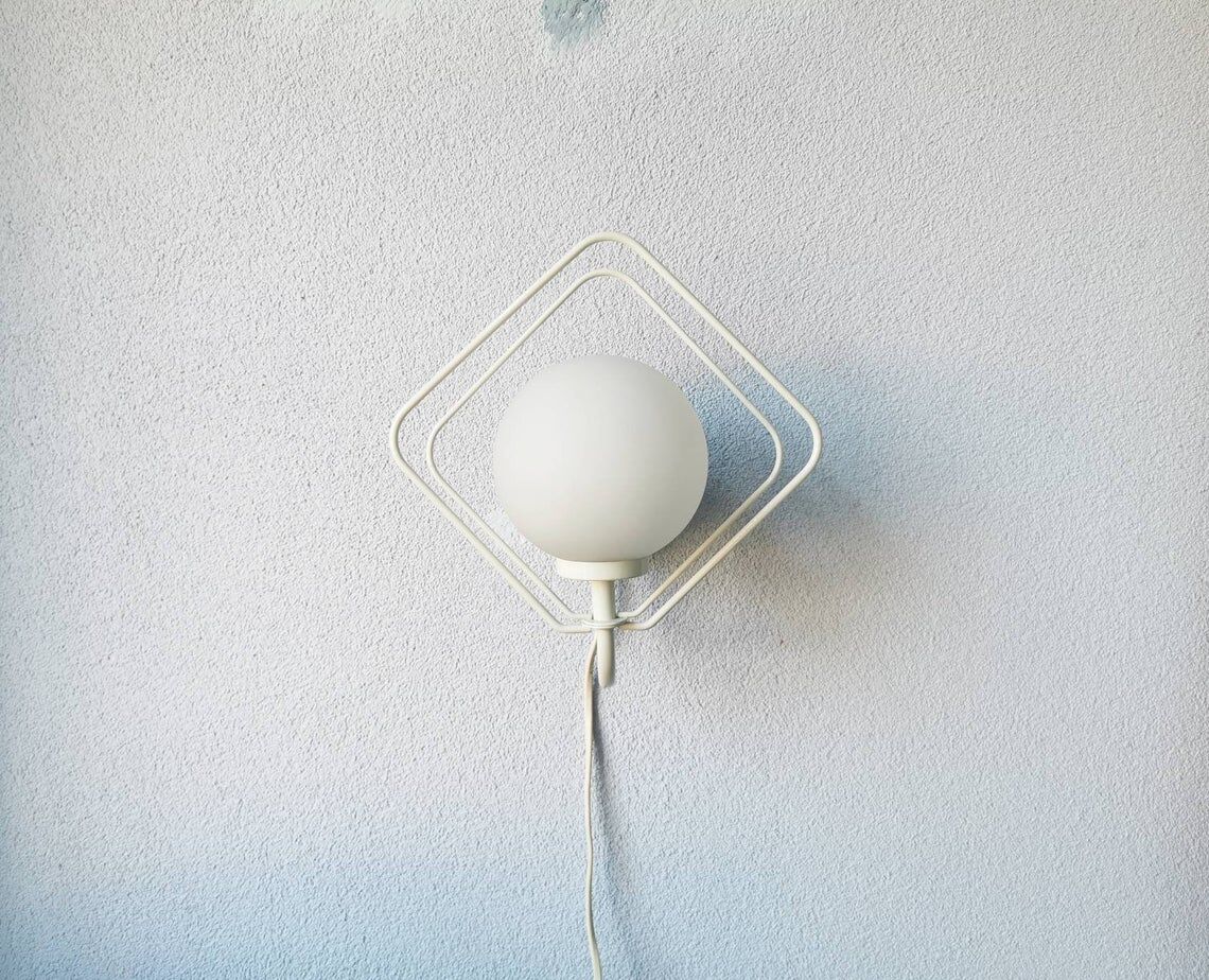 Metal applique with 80s glass sphere