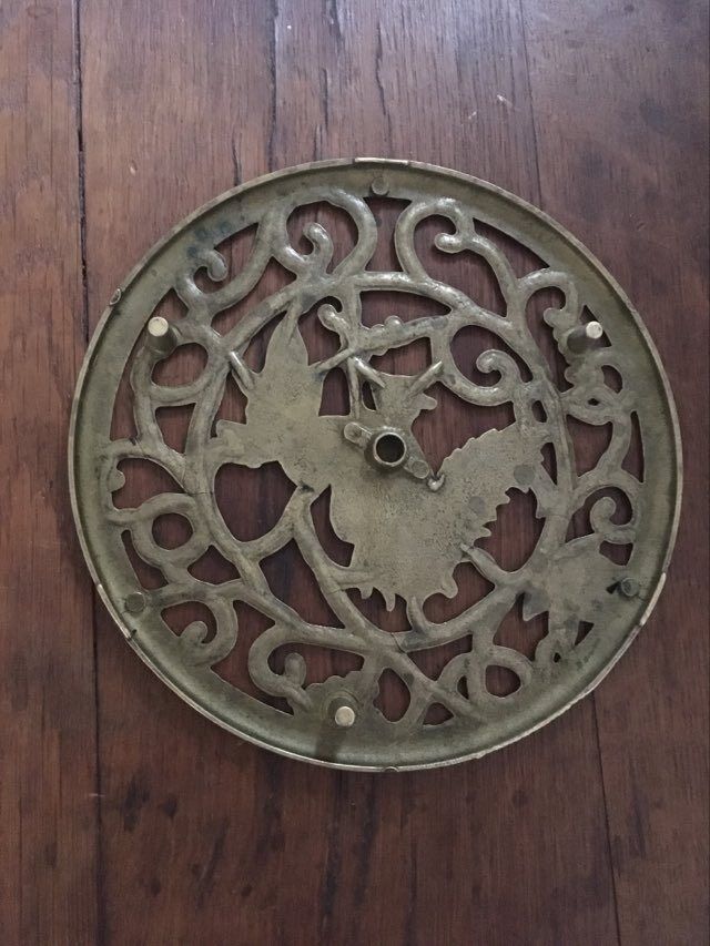 Underneath the brass dish