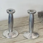 Pair of minimalist polished aluminium candle holders
