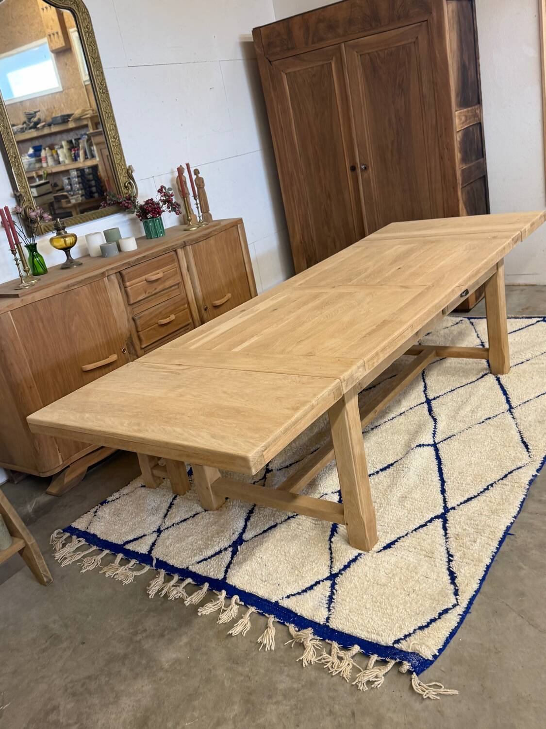 Solid oak extendable farmhouse table with 2 drawers.