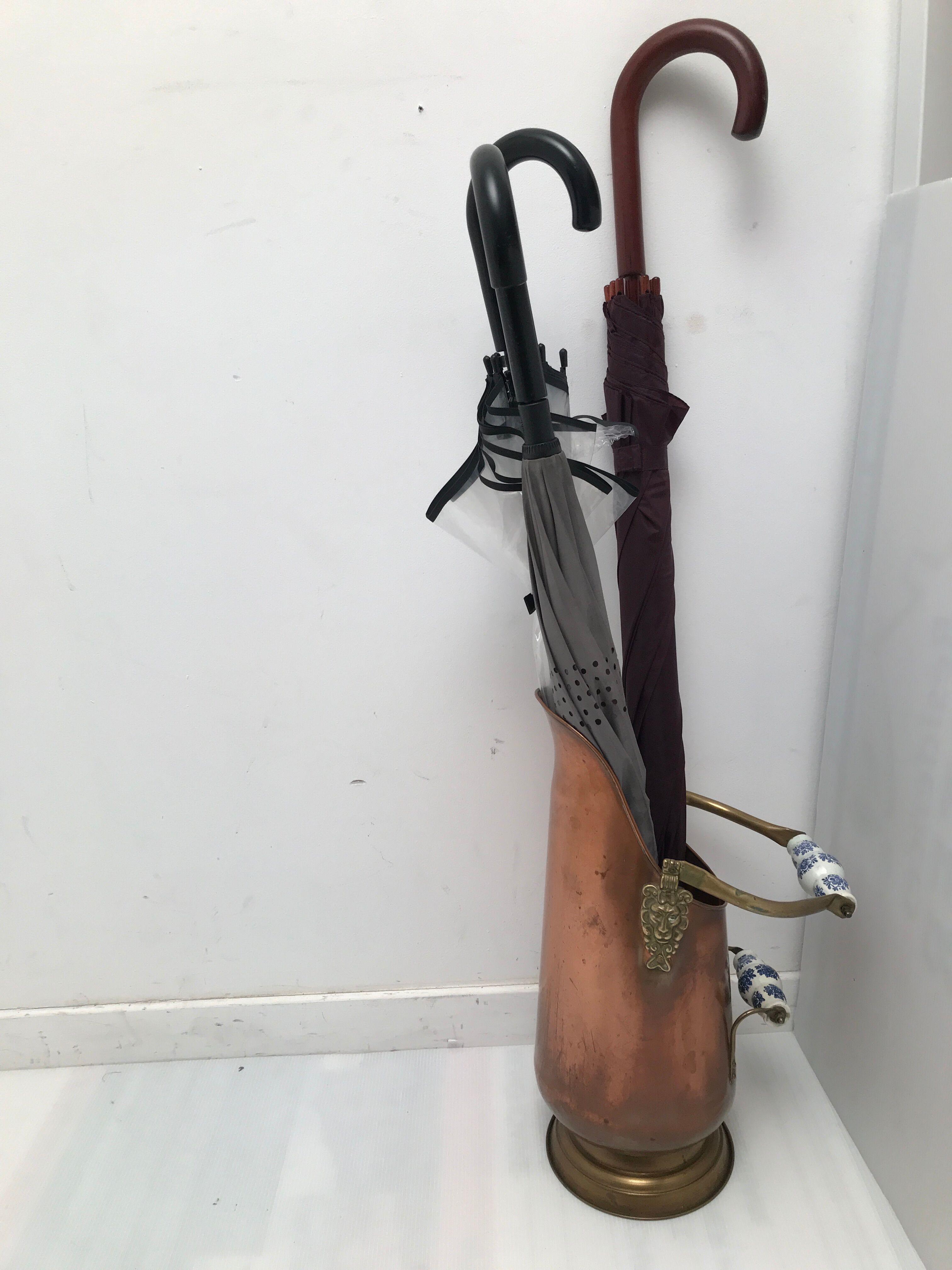 Copper umbrella holder and vintage porcelain handles