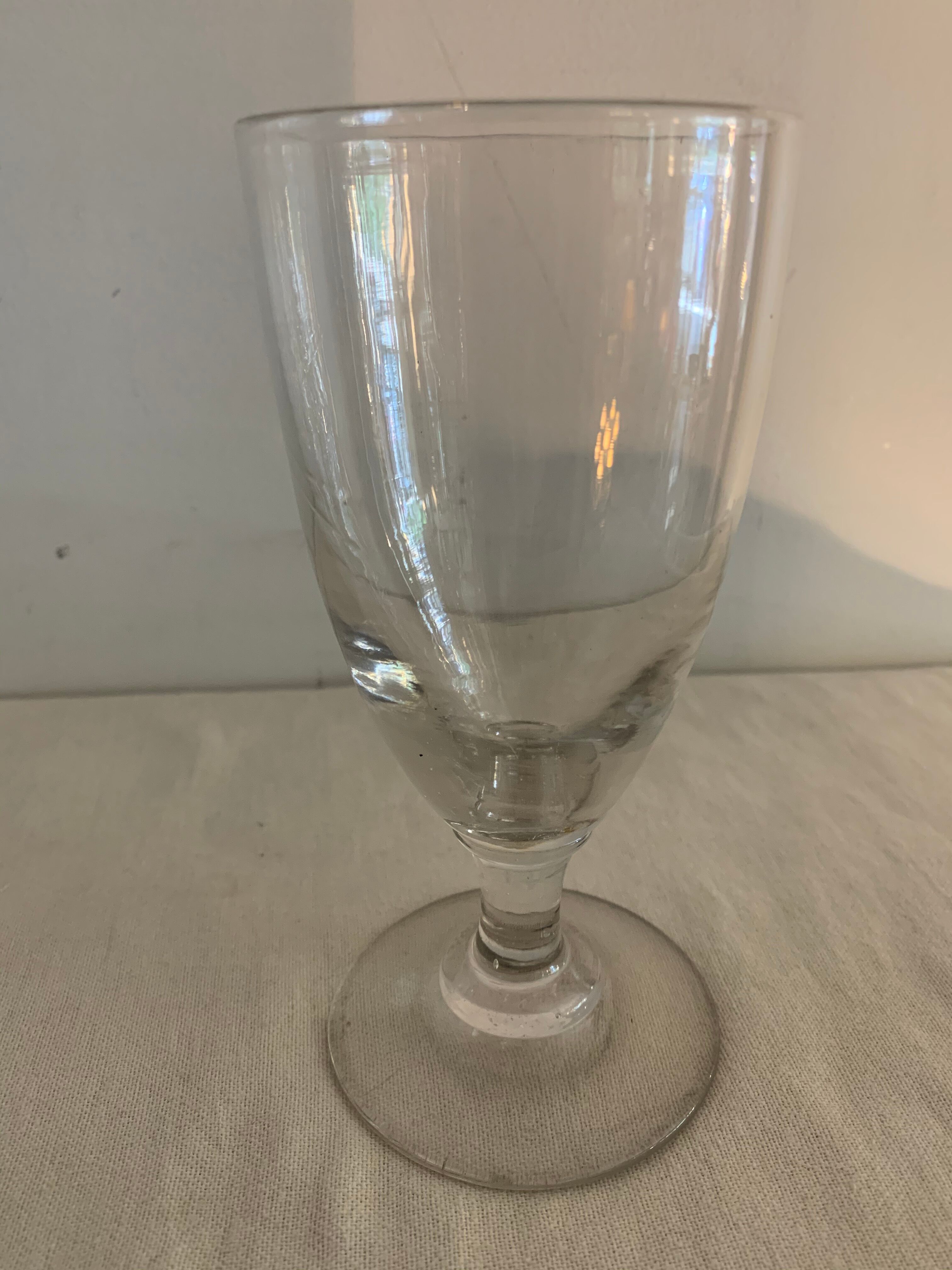 8 old blown and different foot wine glasses