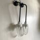 Pair of Art Deco wall lights in cast iron, glass and ceramic from the 1930s.