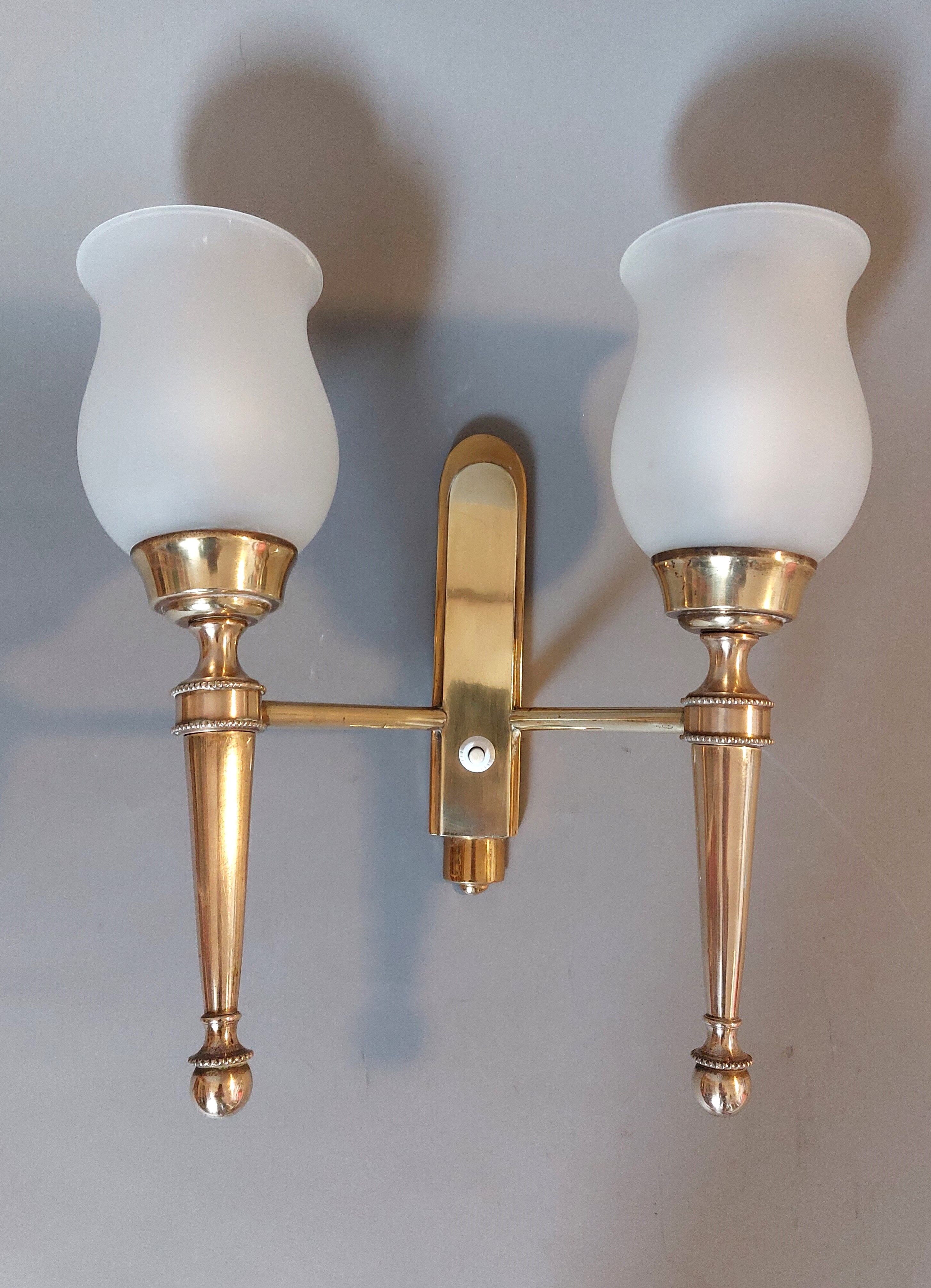 Neoclassical Torch two-arm wall lamp in solid brass, circa 1940