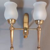 Neoclassical Torch two-arm wall lamp in solid brass, circa 1940