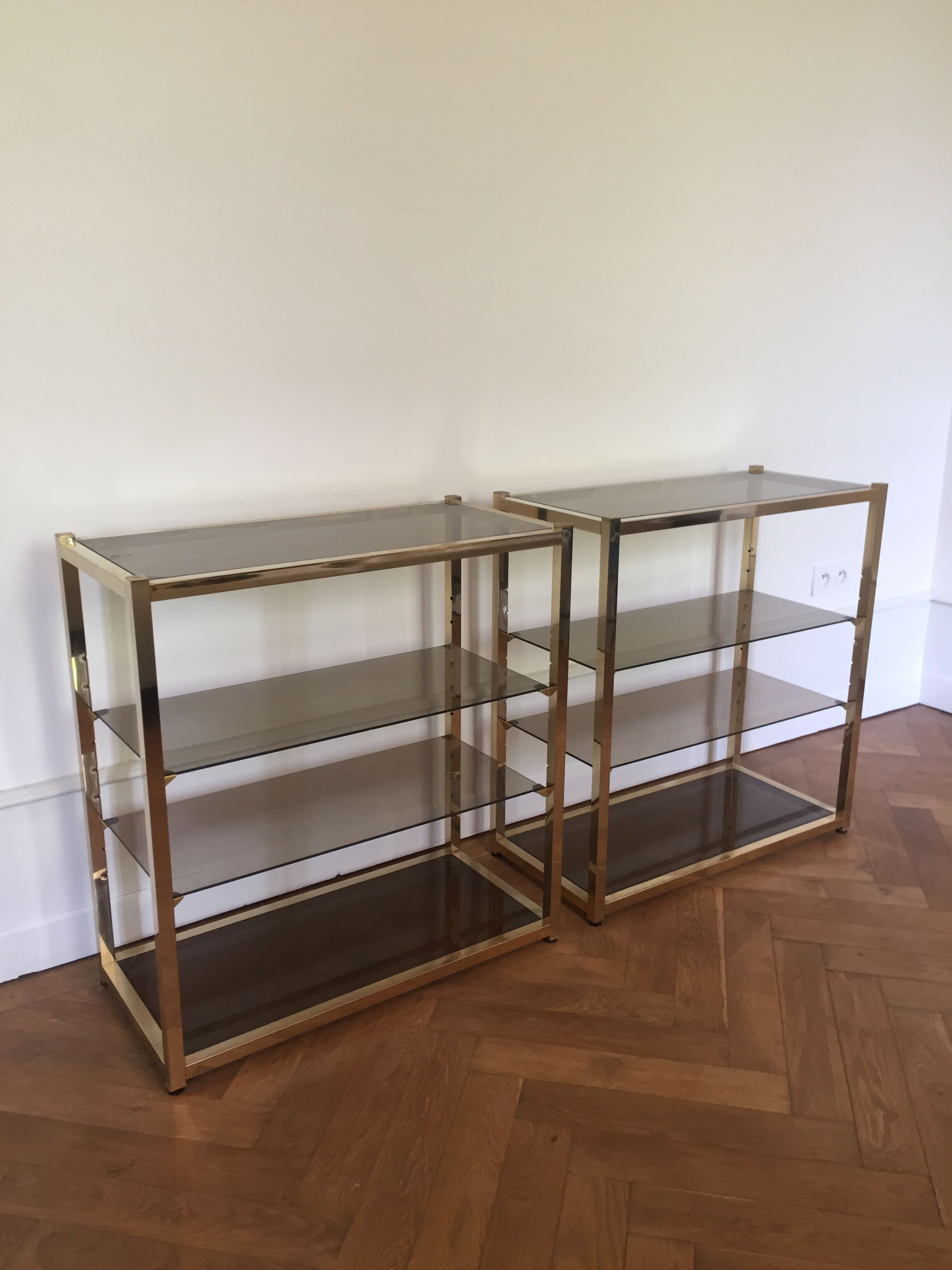 Pair of consoles brass shelves and smoked glass design Roche Bobois