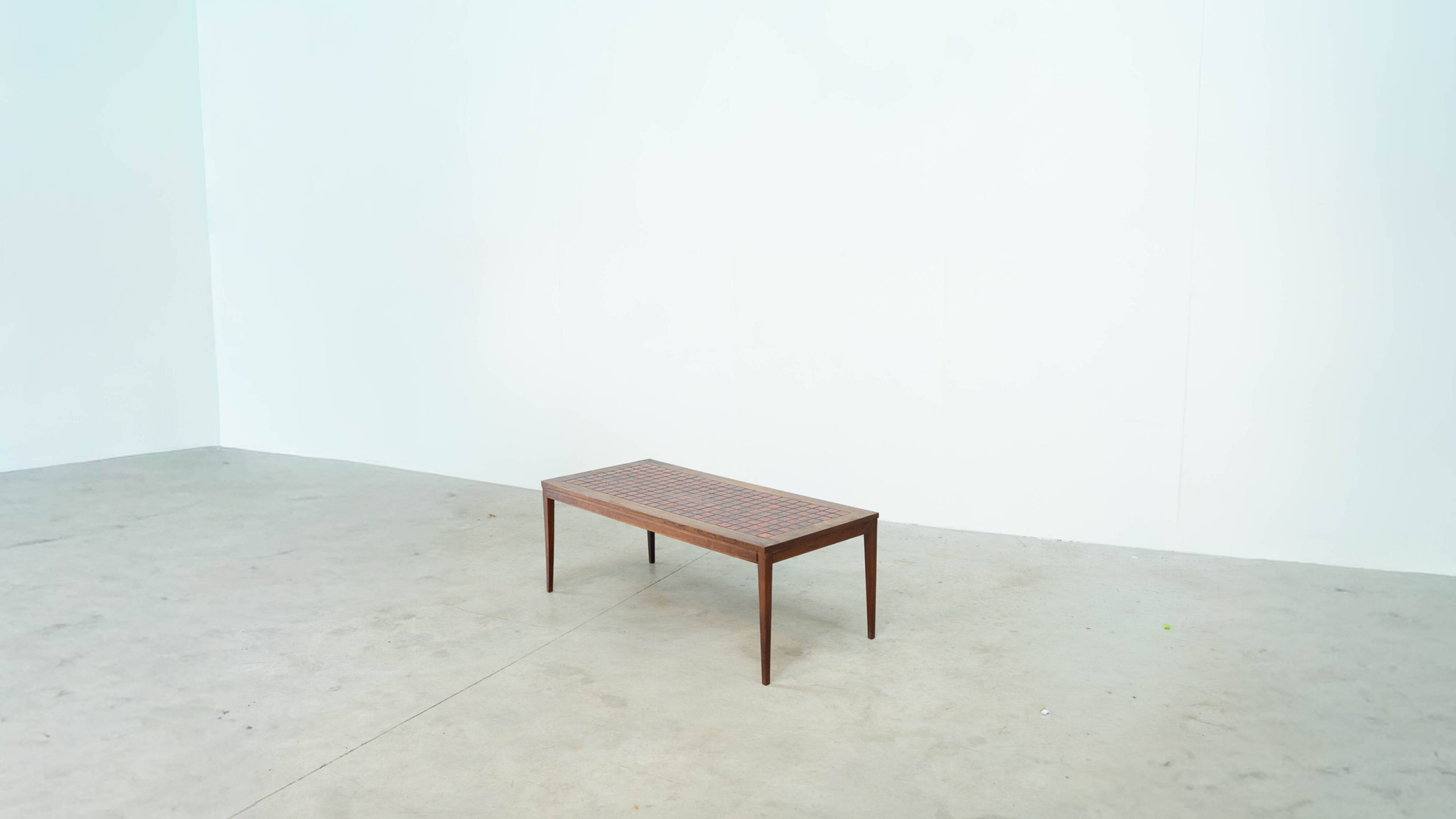 Danish red ceramic and teak coffee table