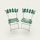 Pair of original patinated folding Parisian bistro chairs.