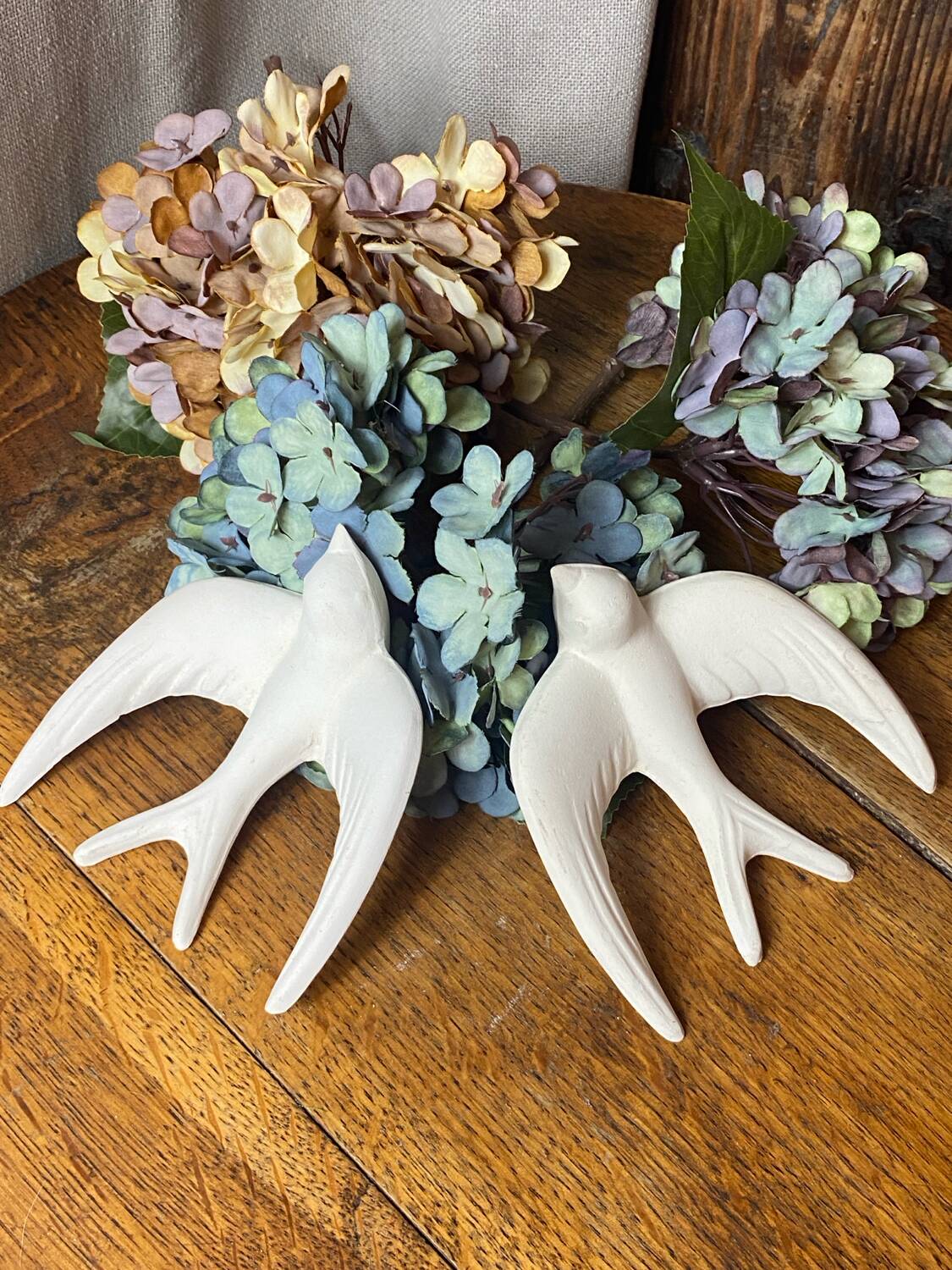 Pair of plaster swallows