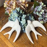 Pair of plaster swallows