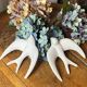 Pair of plaster swallows
