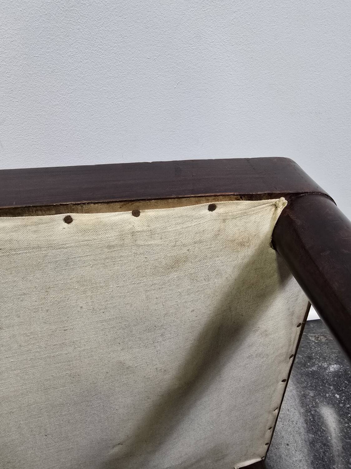 Vintage wooden ottoman from the 1940s with a silk top and studded trim.