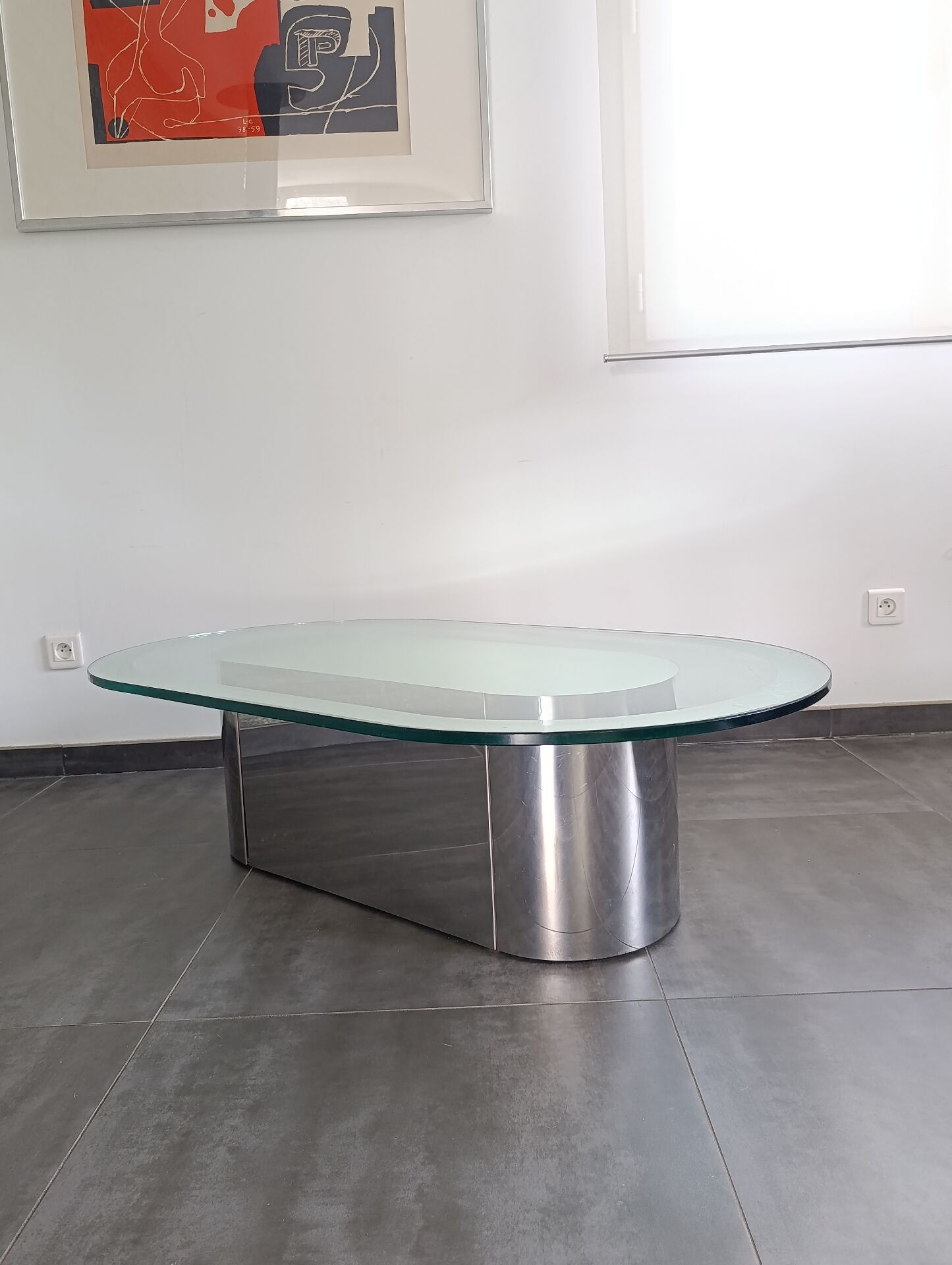 Vintage coffee table with glass and chrome metal.