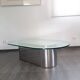 Vintage coffee table with glass and chrome metal.