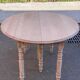 Louis Philippe round extendable dining table with renovated leaves and 4 extensions.