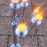 Standing candlestick in stainless steel metal with 5 movable branches, with smooth ring for 4 cm candles.