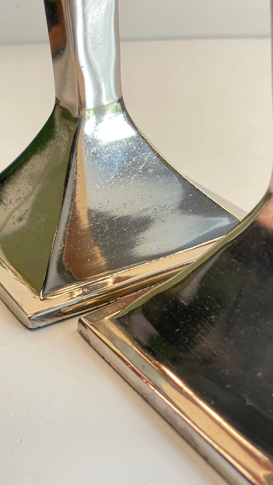 Pair of vintage cast aluminum candlesticks