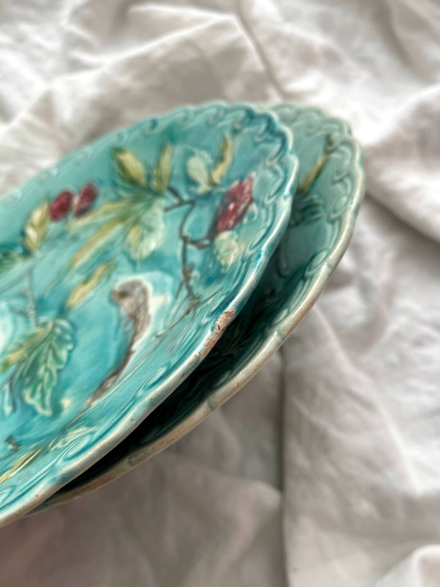 Two Onnaing barbotine bird plates, late 19th century