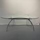 Table, bureau en aluminium brossé et verre formant "rognon" par Bernard Dequet