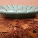 Art Deco ceramic pocket vase in celadon green and gold, style Arthur Percy L34/P22.