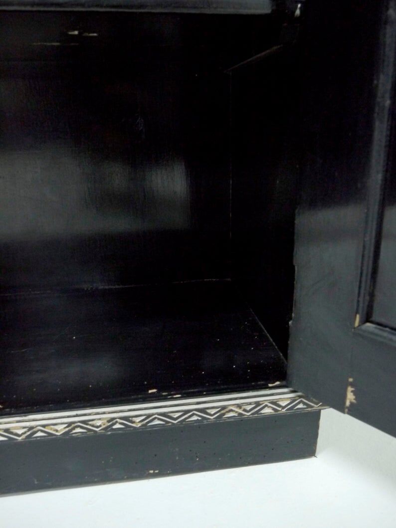 Antique wooden cabinet painted in black and with incised white painted decorations, Ettore Zaccari, Italy c 1910