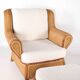 Large wicker armchair and its ottoman