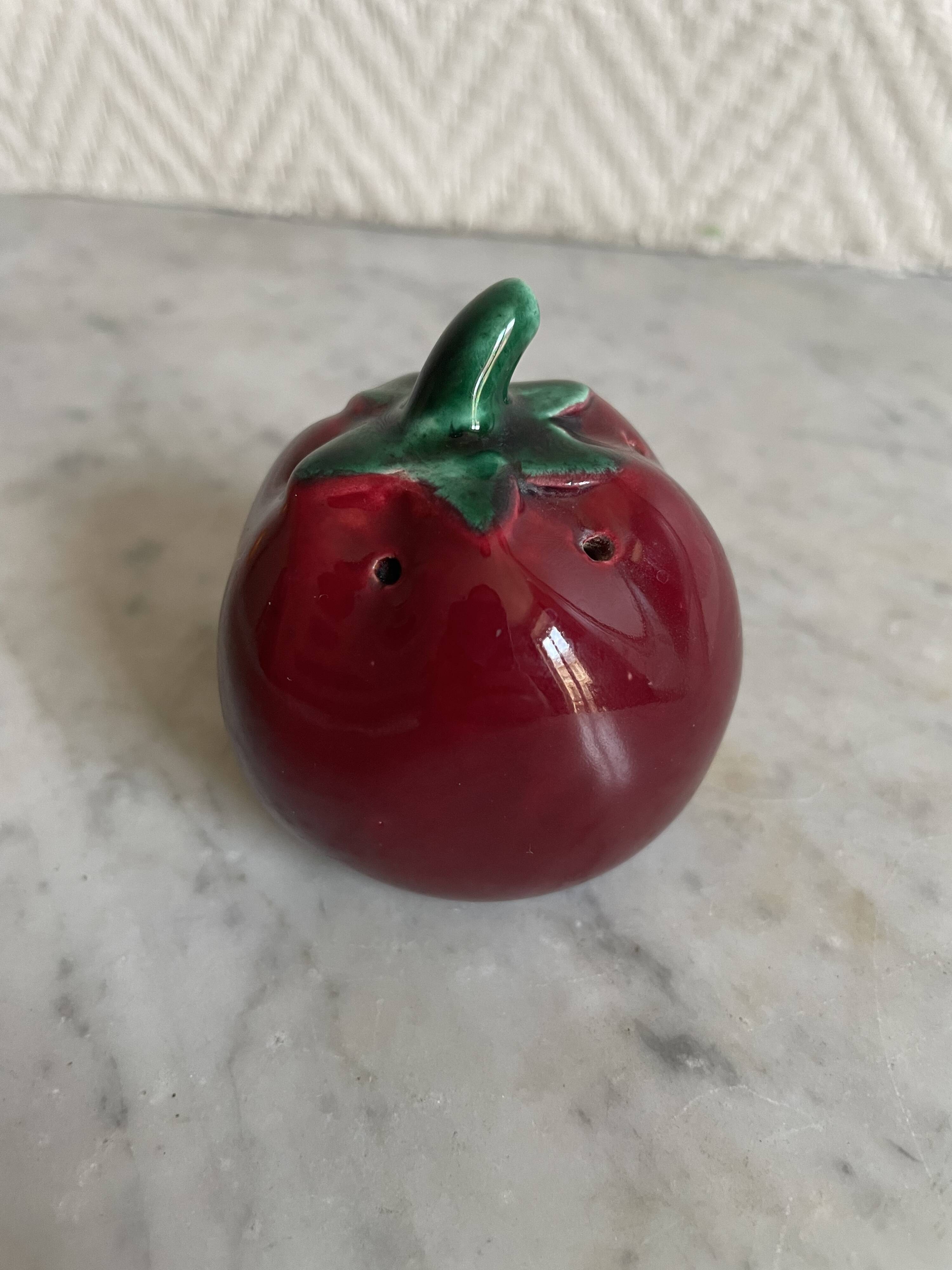 Set of ceramic salt and pepper shakers in the shape of a pumpkin tomato