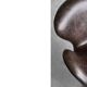 Brown leather Swan chair by Arne Jacobsen, mid-century Danish modernity.