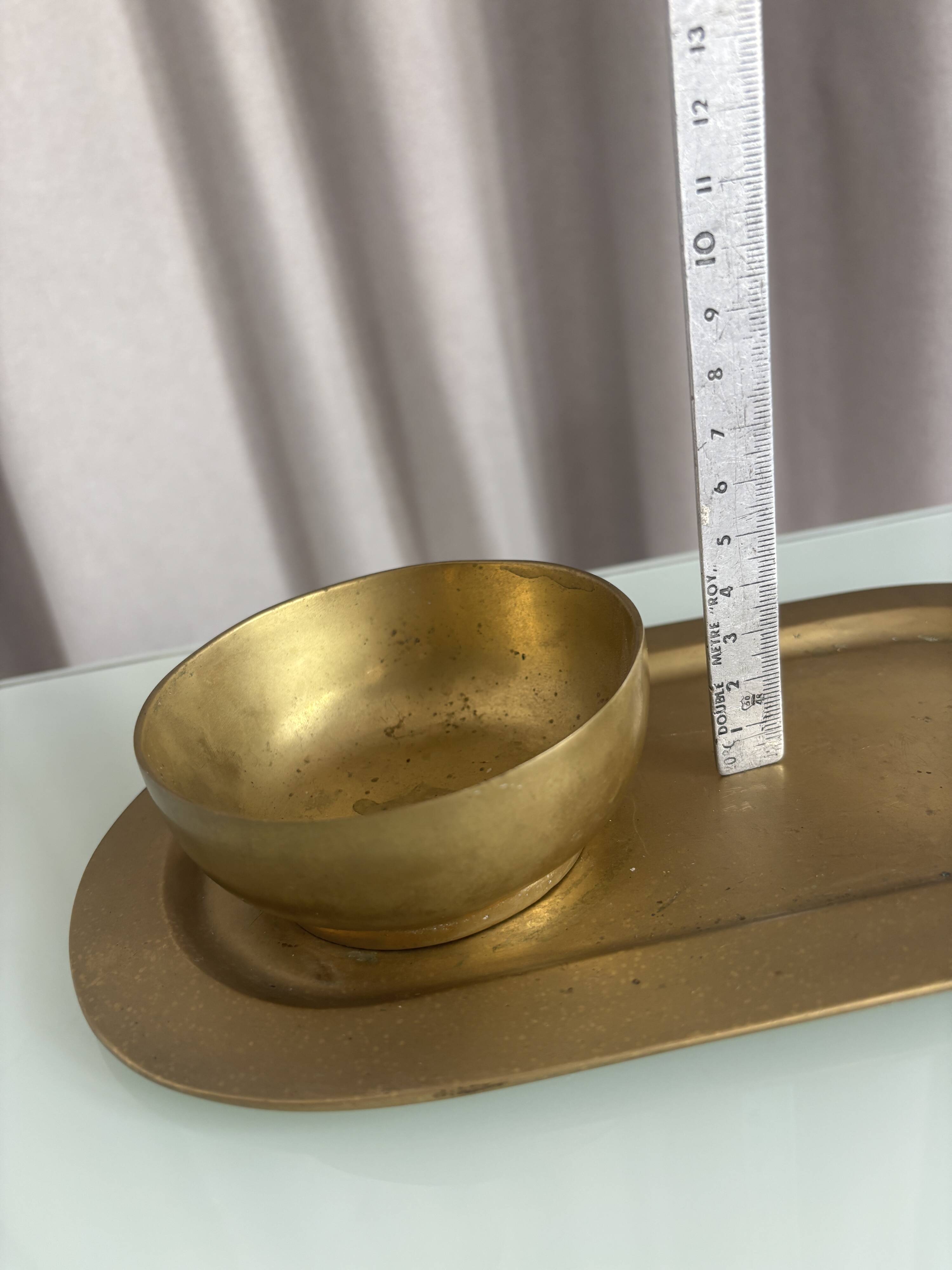 Empty pocket ensemble and bowl in solid brass signed Giò Lanciani.