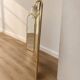 Vintage triptych mirror in brass with wall lights.
