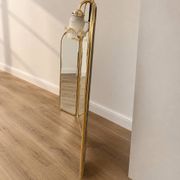 Vintage triptych mirror in brass with wall lights.
