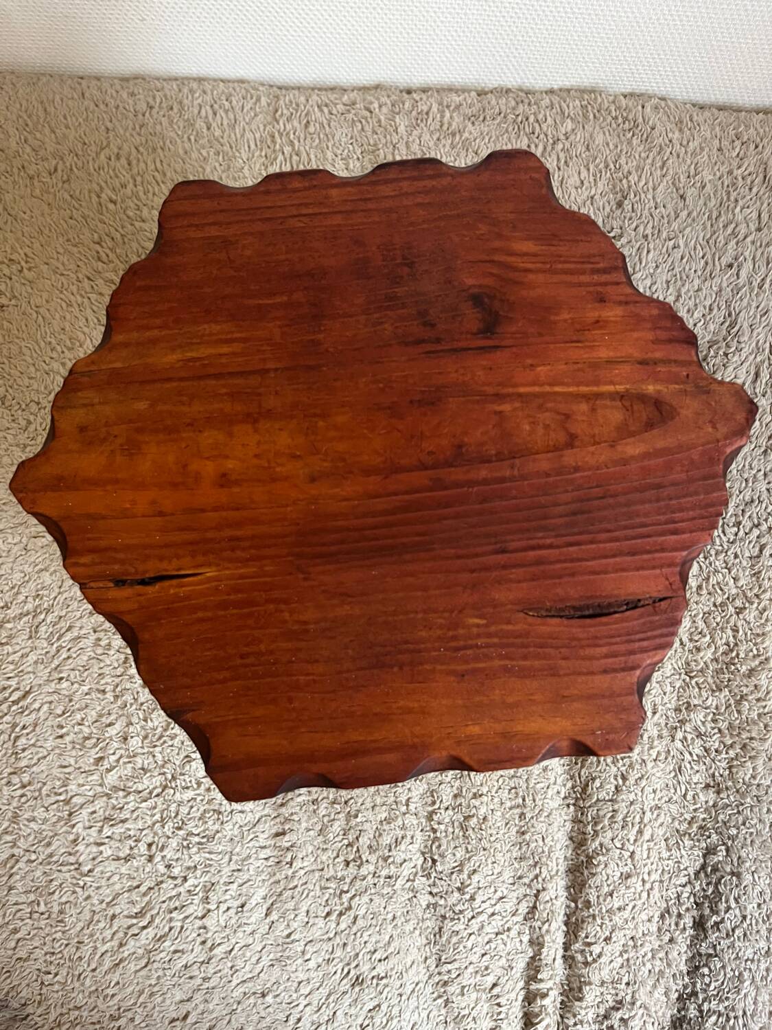 Wooden tripod stool in mountain chalet style