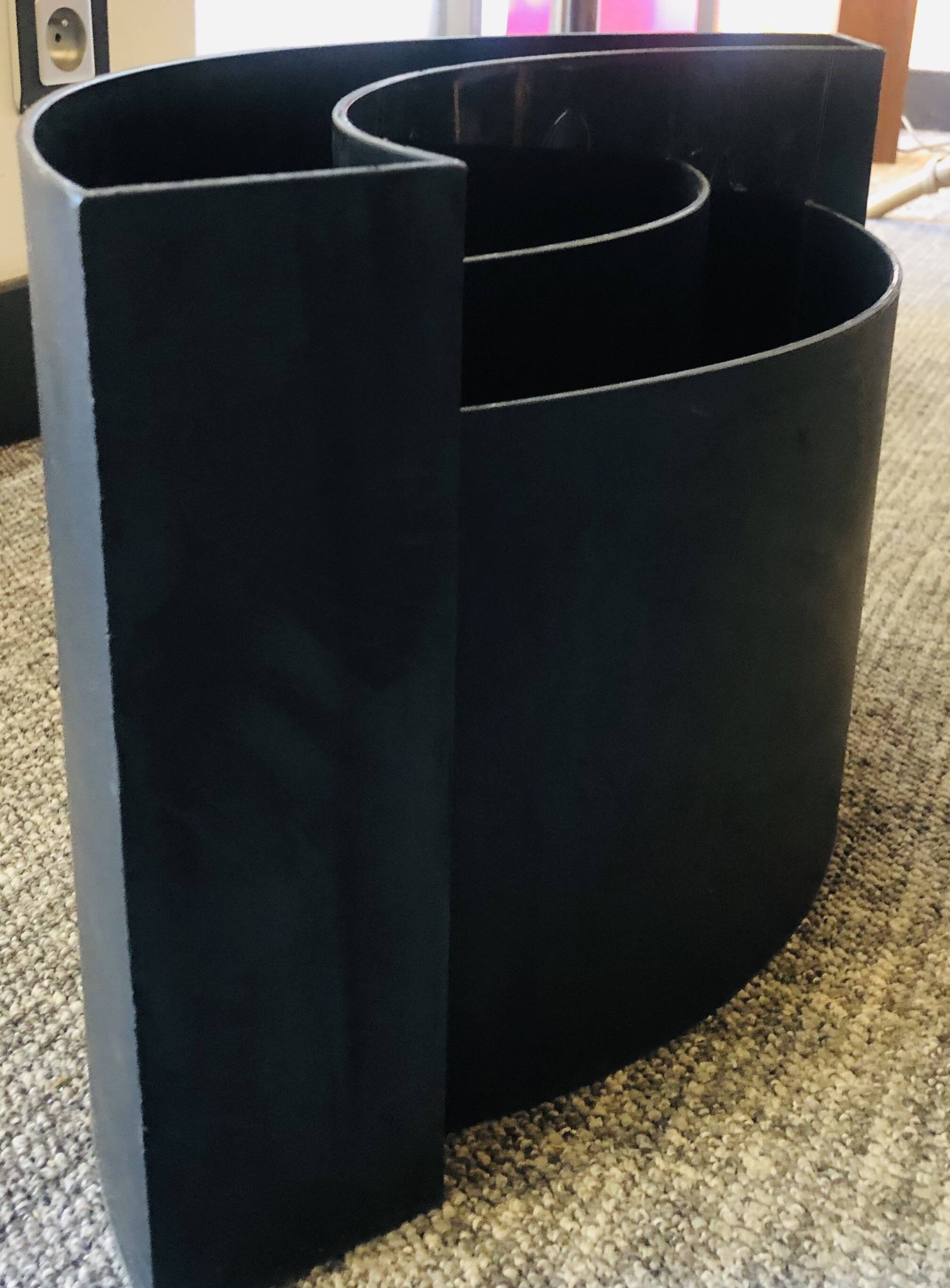 Magnificent black magazine rack.