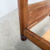Brutalist style bed with chain and straw