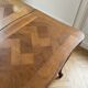 Extendable dining table in Louis XV style made of wood.